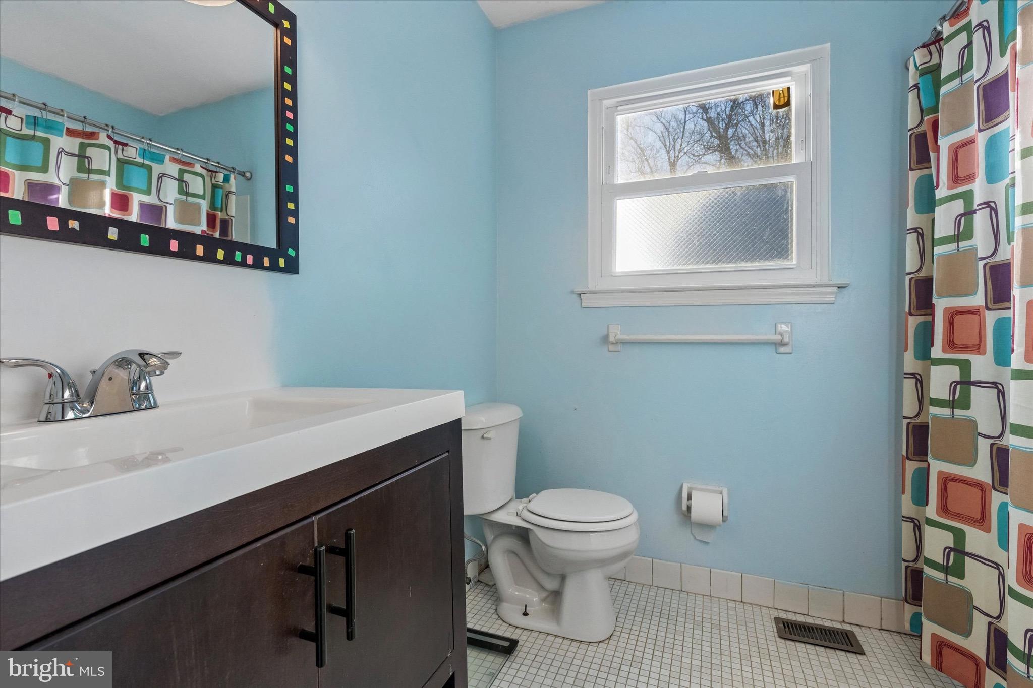 1126 Plowshare Road Blue Bell, PA 19422 - Photo 15 of 30 a bathroom with a toilet a sink and mirror