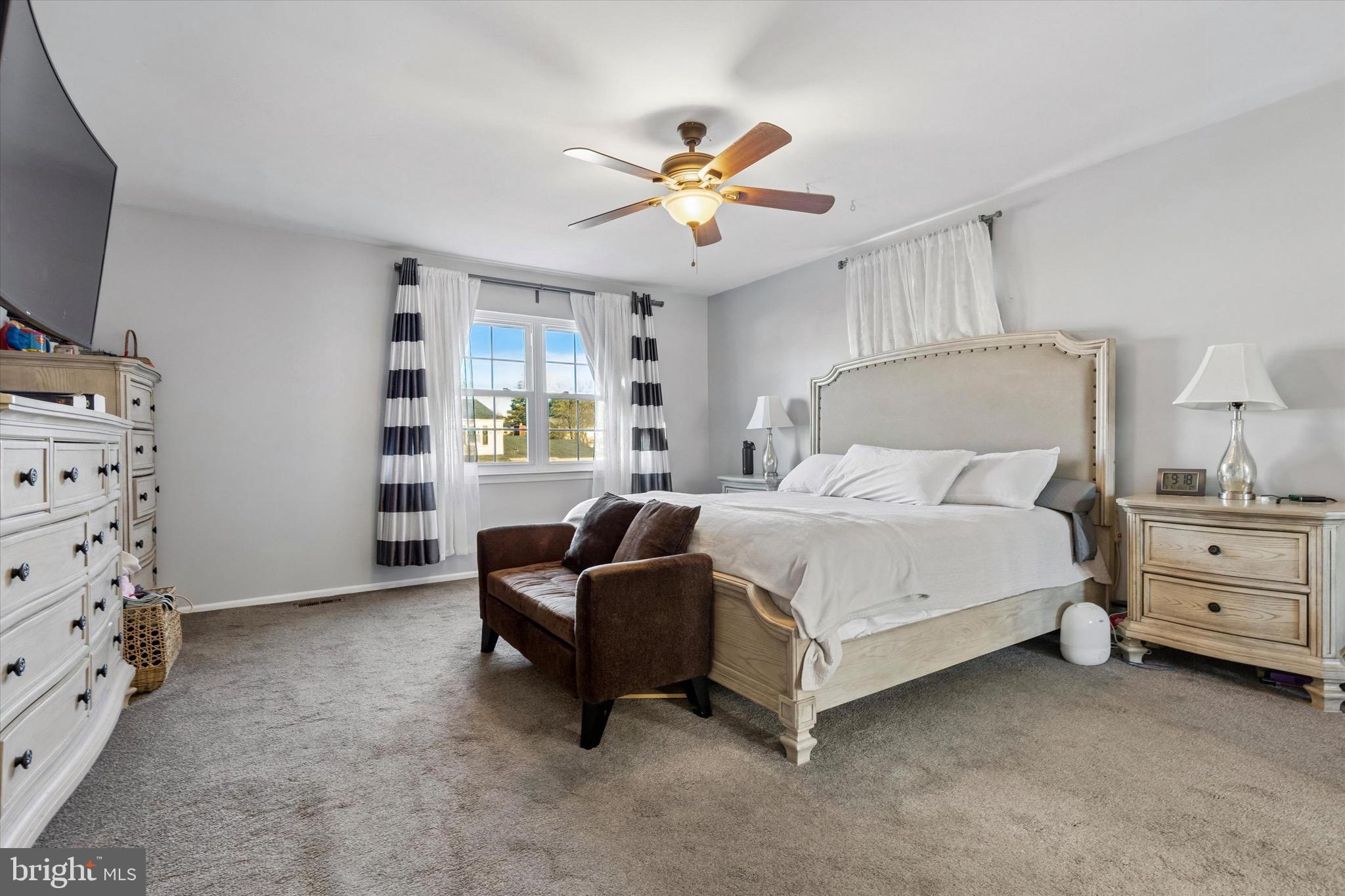 1126 Plowshare Road Blue Bell, PA 19422 - Photo 16 of 30 a bedroom with a bed and a flat tv screen on dresser