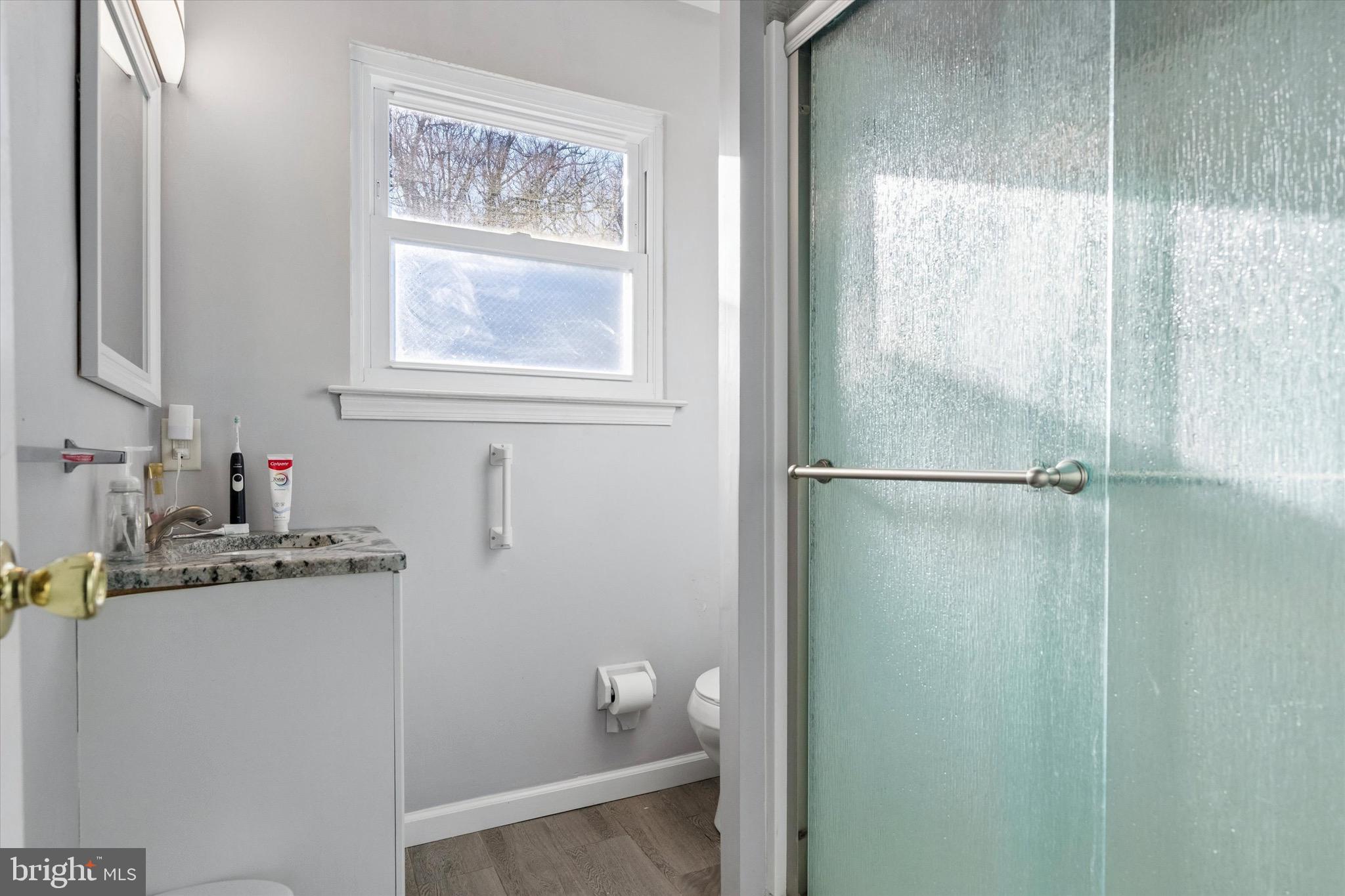 1126 Plowshare Road Blue Bell, PA 19422 - Photo 19 of 30 a bathroom with a granite countertop sink a shower and a mirror