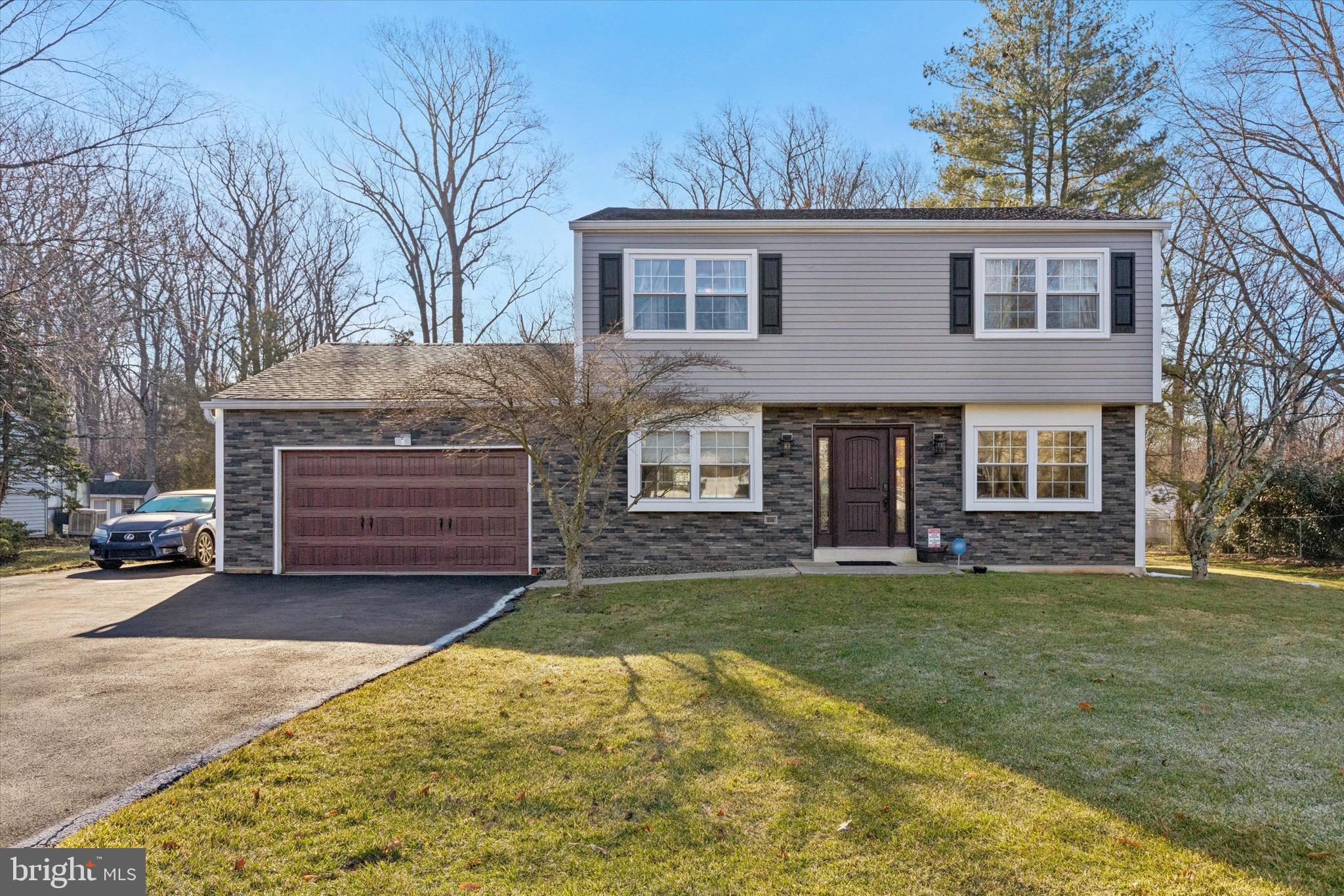 1126 Plowshare Road Blue Bell, PA 19422 - Photo 2 of 30 a front view of a house with a yard