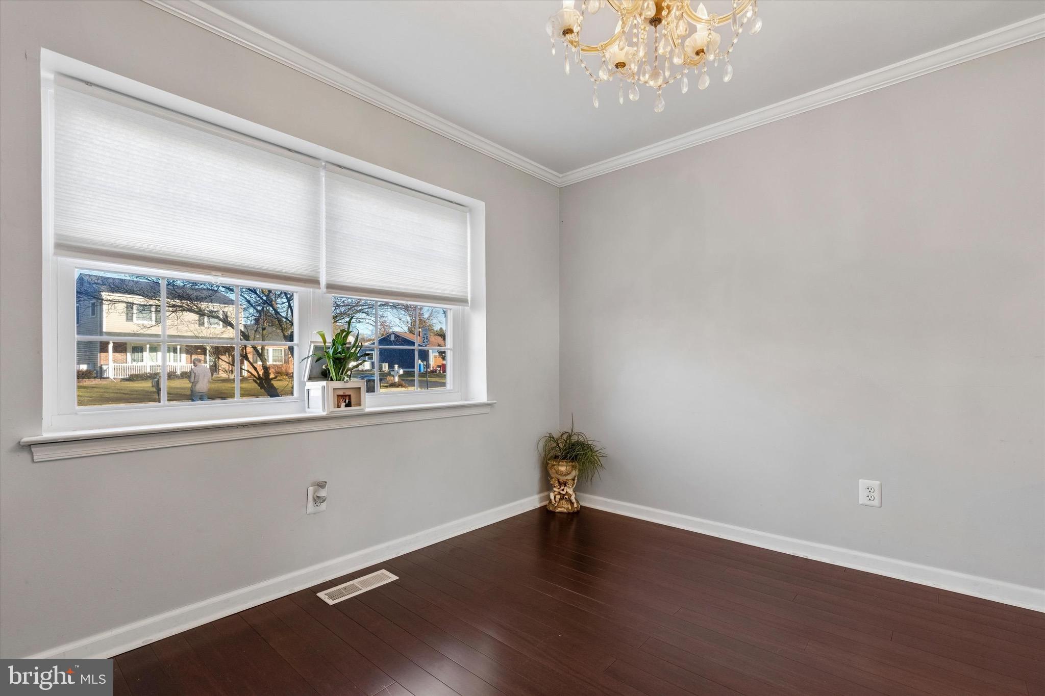 1126 Plowshare Road Blue Bell, PA 19422 - Photo 8 of 30 an empty room with wooden floor and windows