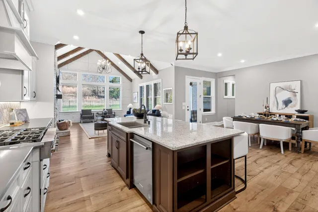 a dining room with furniture and wooden floor