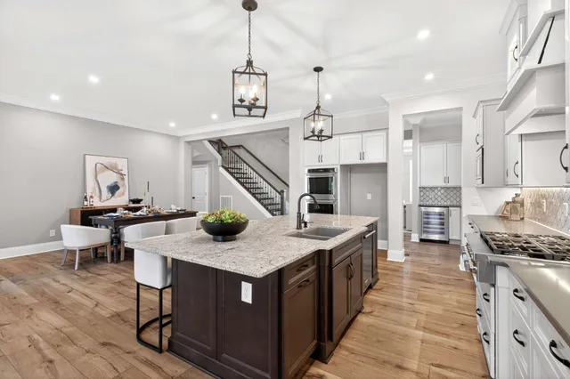 a living room with furniture fireplace and a large window