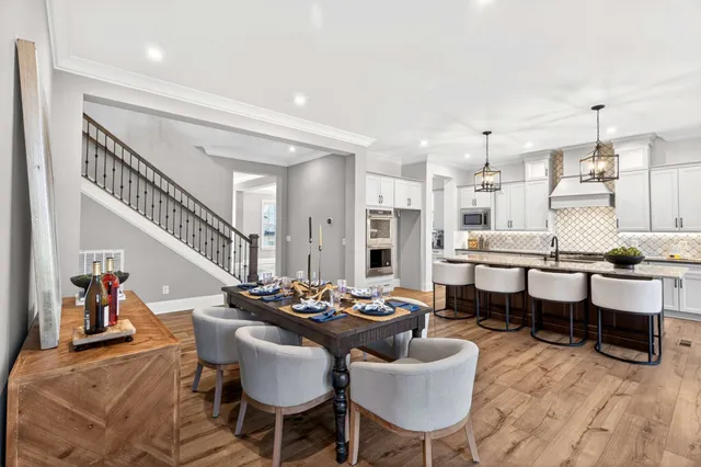 a bed sitting in a bedroom next to a lamp