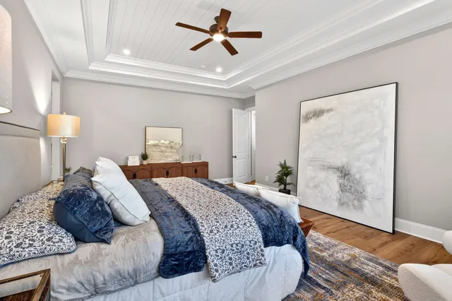 a bathroom with a tub a double vanity sink double vanity and mirror