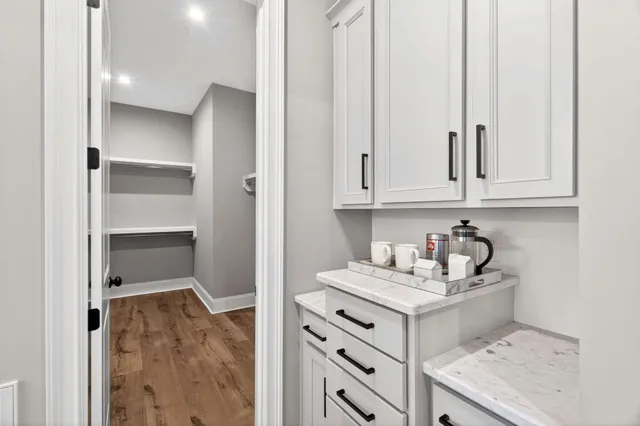 a kitchen with stainless steel appliances granite countertop a refrigerator sink and stove