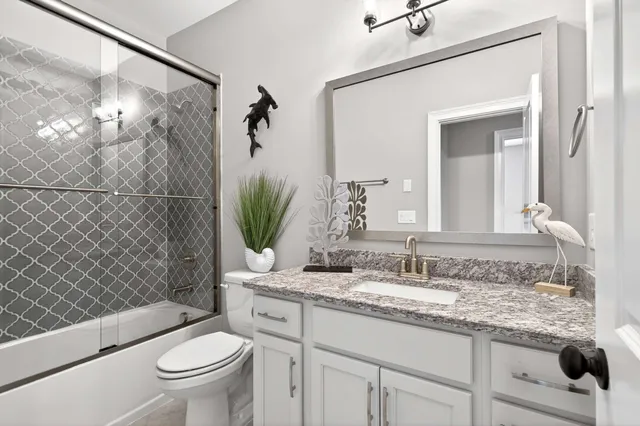 a bedroom with a bed and a table in it