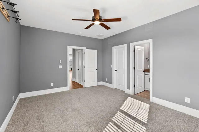 a bedroom with bed and window