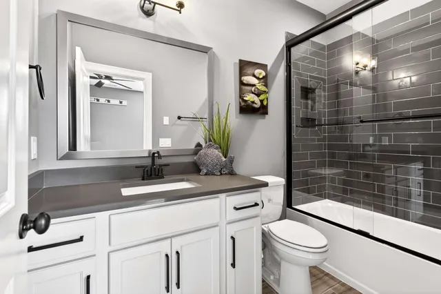 a bedroom with a bed and a chair