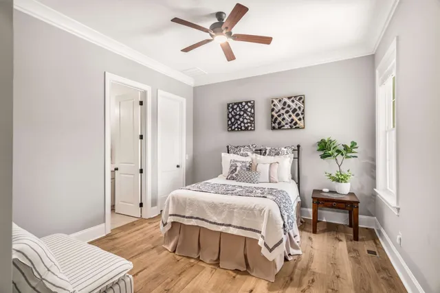 a bedroom with a large bed and a couch