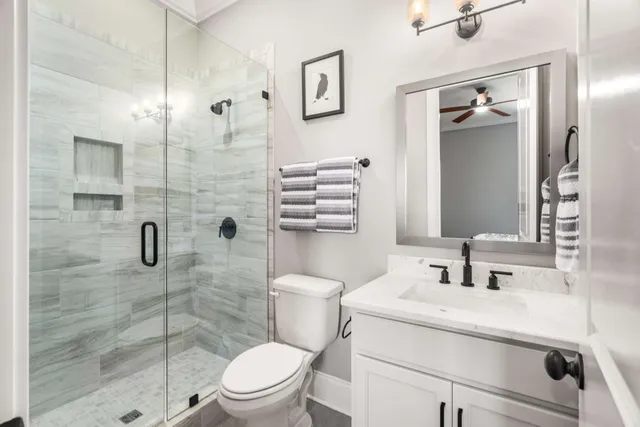 a view of a sign in front of flowers