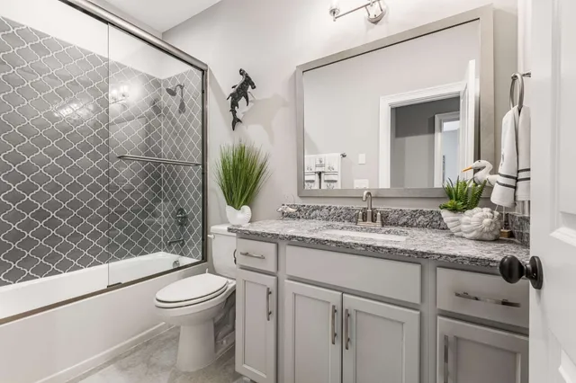 a view of a street with a wooden fence