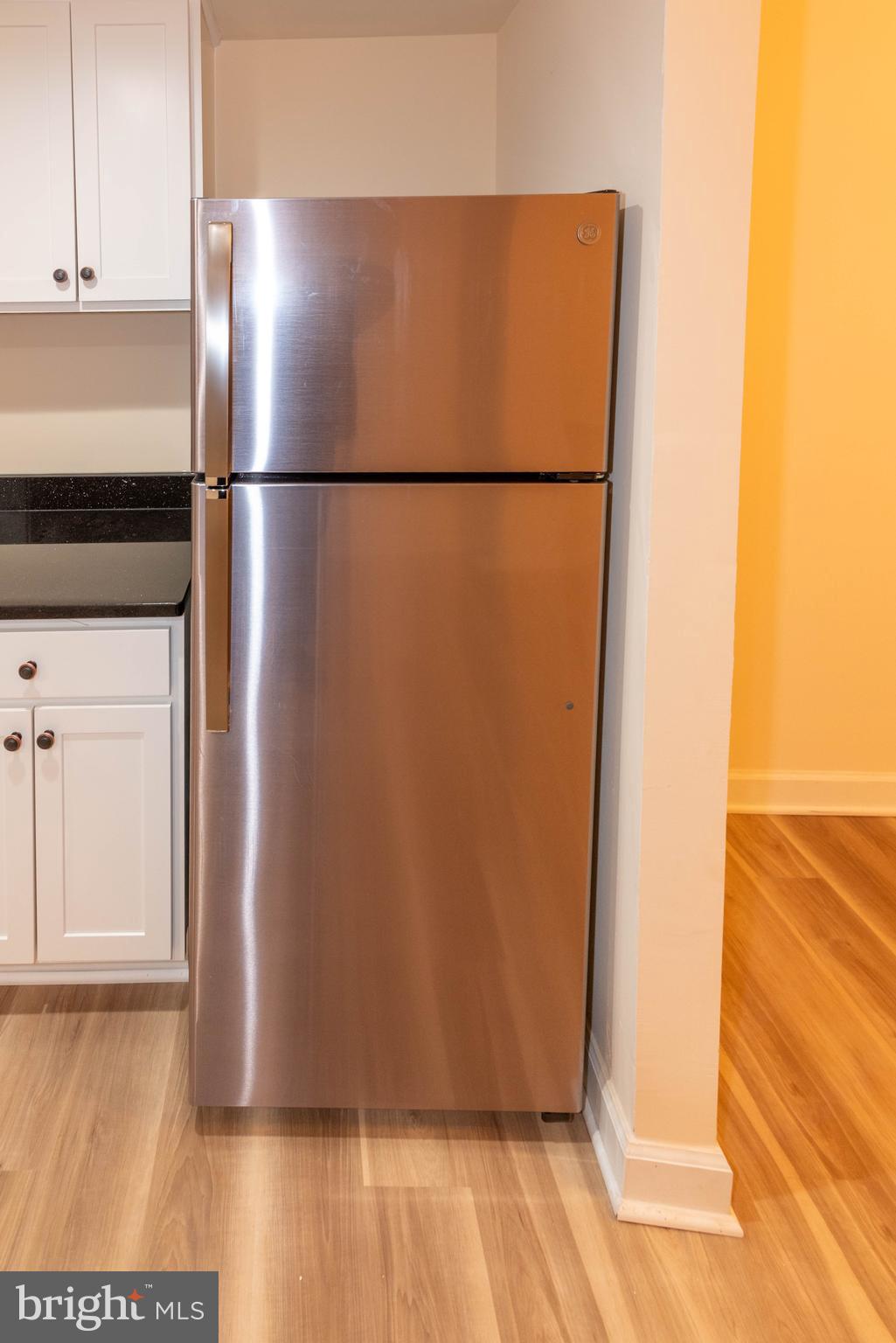 2000 Hollins Ferry Road Baltimore, MD 21230 - Photo 14 of 43 a view of a refrigerator in kitchen and an empty room