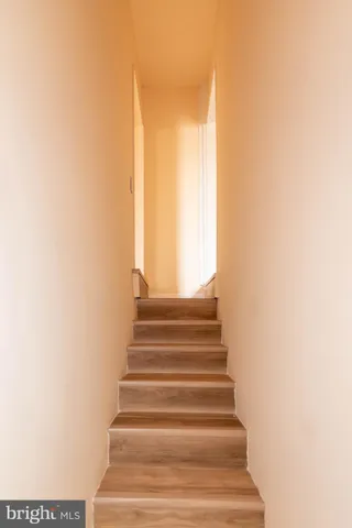 a view of room with wooden floor