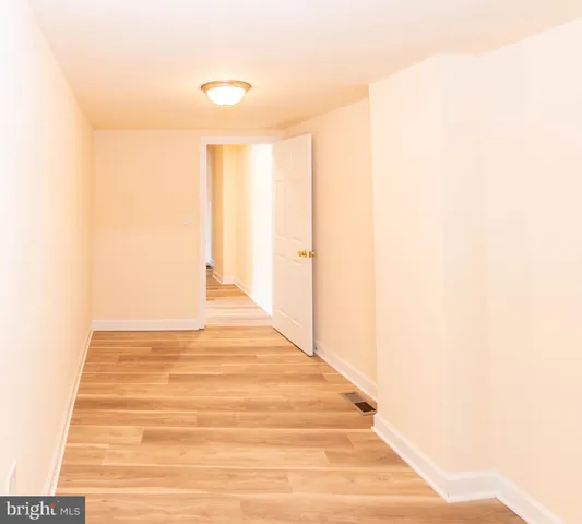 a white toilet sitting next to a shower
