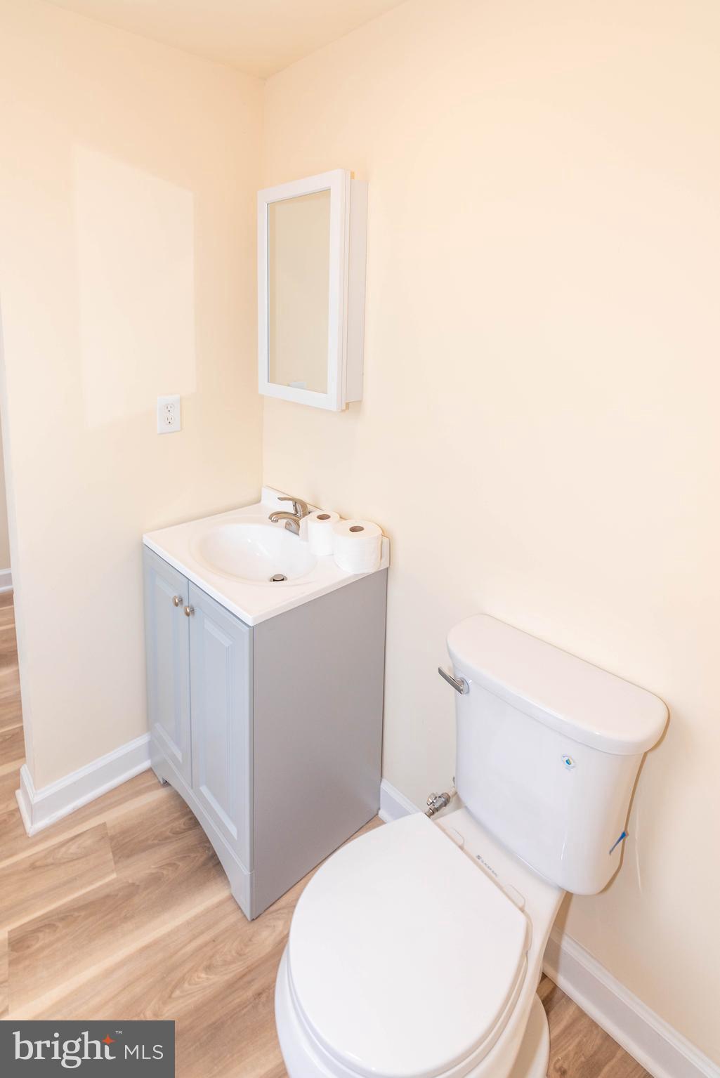 2000 Hollins Ferry Road Baltimore, MD 21230 - Photo 34 of 43 a white toilet sitting next to a bathroom sink