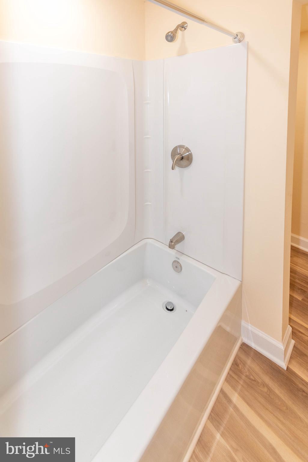 2000 Hollins Ferry Road Baltimore, MD 21230 - Photo 35 of 43 a bathroom with a tub and a shower