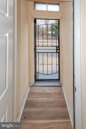 a view of a room with wooden floor