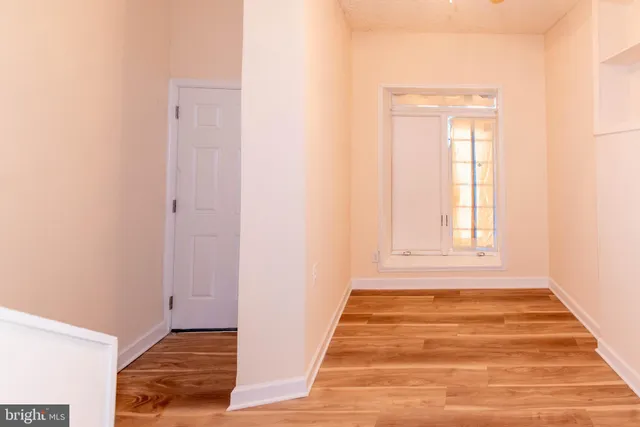 a kitchen with stainless steel appliances kitchen island granite countertop a refrigerator and a stove top oven