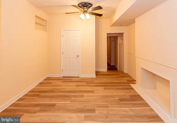a kitchen with granite countertop a stove top oven microwave and cabinets