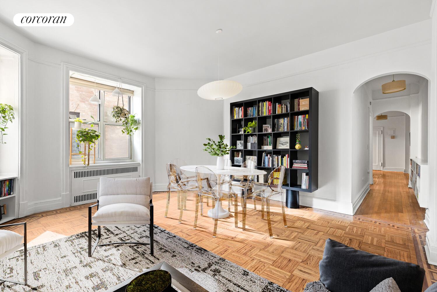 301 West 108th Street, Unit 2B Manhattan, NY 10025 - Photo 2 of 6 a living room with furniture a rug and a window