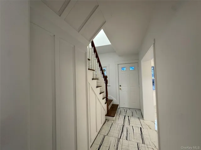 a view of entryway with wooden floor