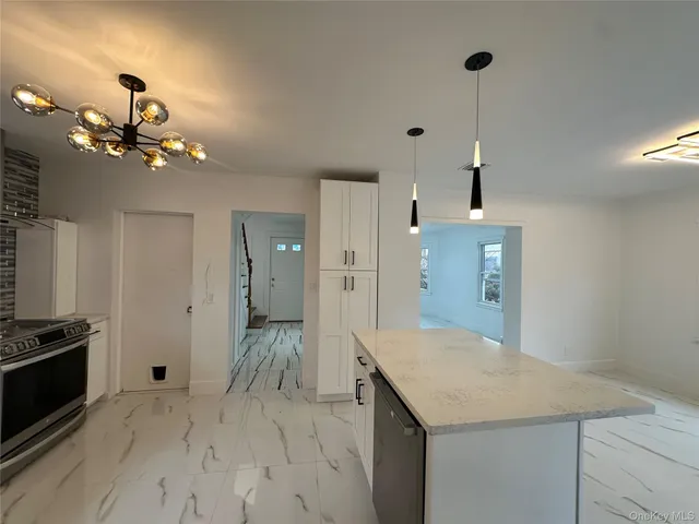 a kitchen with a refrigerator and countertop