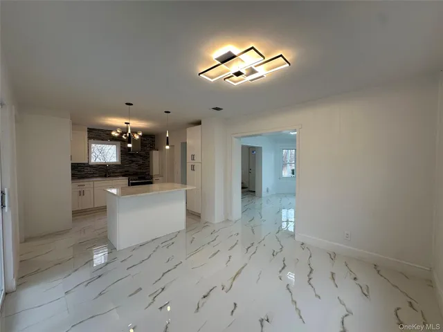a view of a kitchen and a sink
