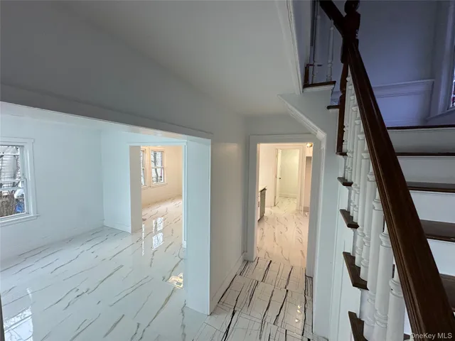 a view of a brick house with large windows