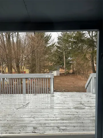 an aerial view of a house with outdoor space