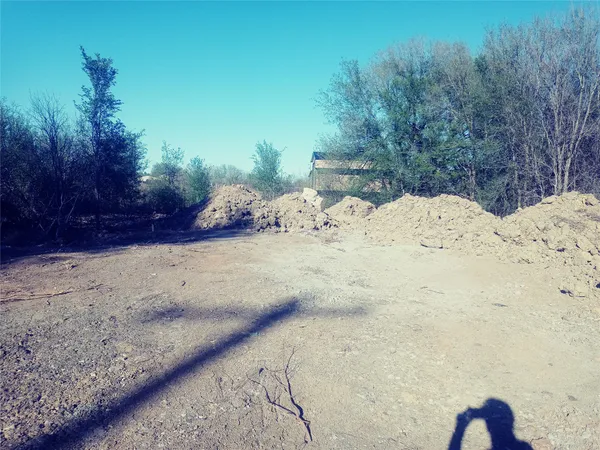 a view of a backyard of the house