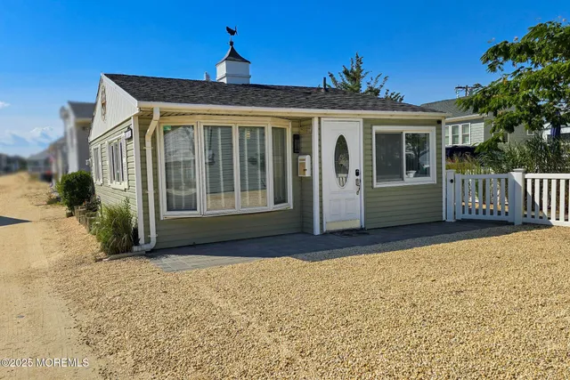 a front view of a house with a porch