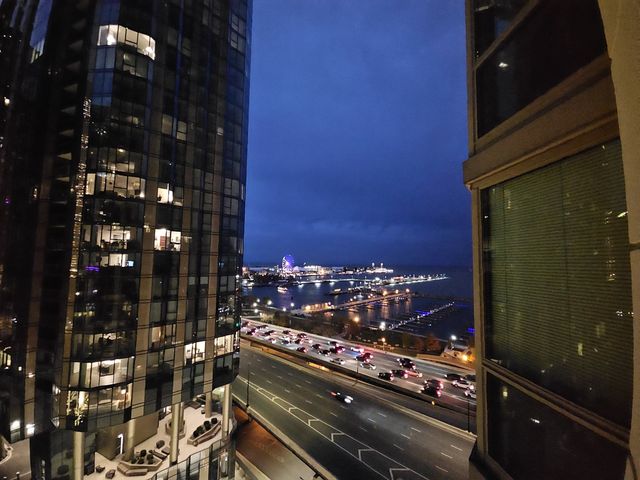a kitchen with stainless steel appliances granite countertop a sink dishwasher stove and oven with wooden floor
