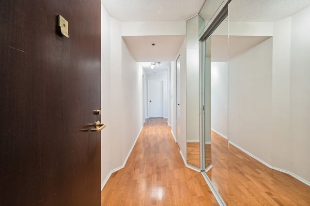 a living room with furniture and large windows