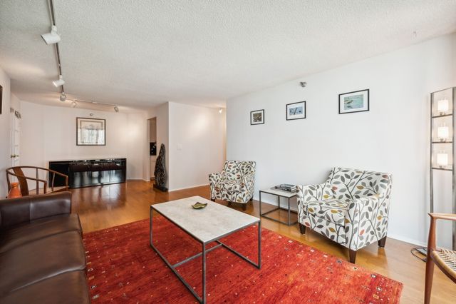 a kitchen with granite countertop a refrigerator and a sink