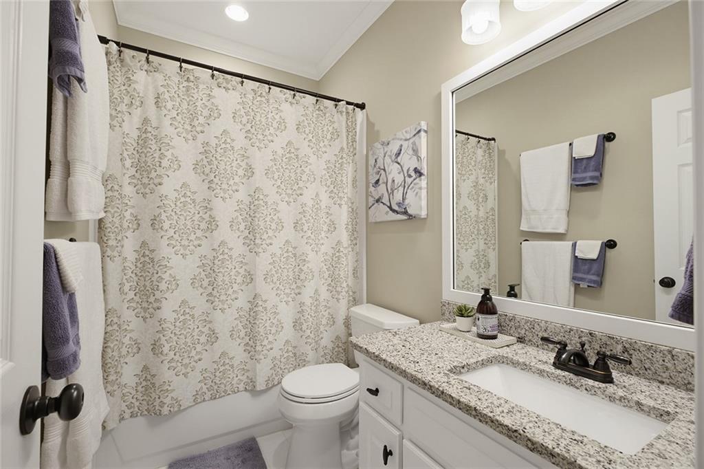 14442 Club Circle Milton, GA 30004 - Photo 21 of 82 a bathroom with a granite countertop sink toilet and shower