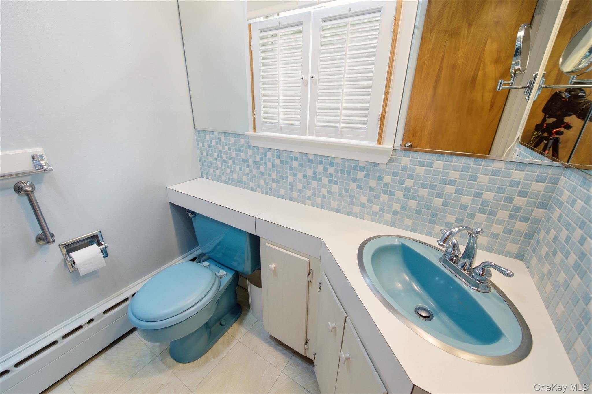 2 Ottawa Avenue Centerport, NY 11721 - Photo 15 of 15 a bathroom with a granite countertop toilet sink and mirror