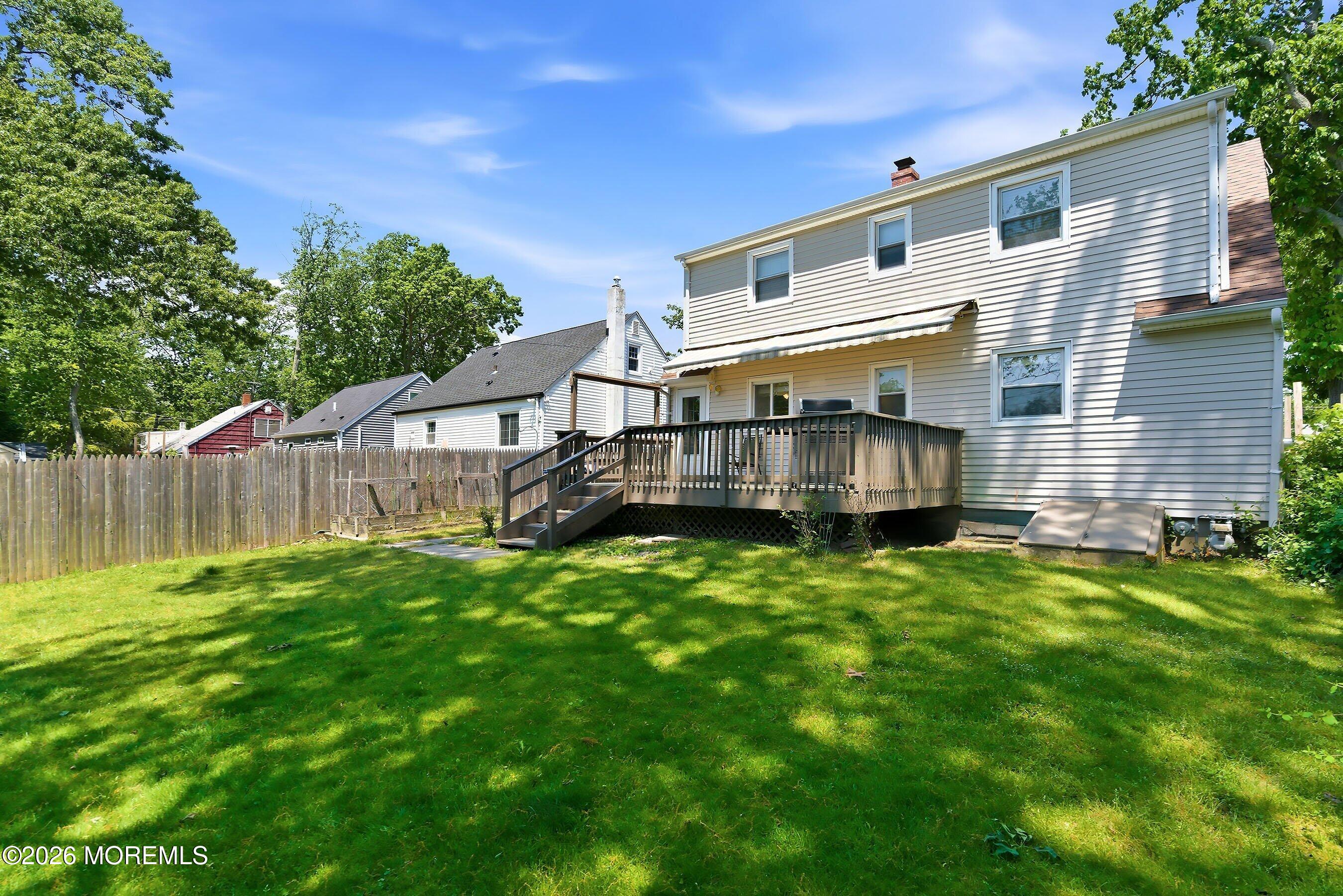 412 Moore Road Neptune Township, NJ 07753 - Photo 30 of 36 a view of backyard with deck and seating area