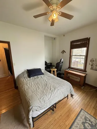 a bedroom with a bed and window