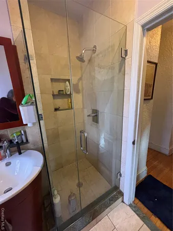 a bathroom with a sink toilet and mirror