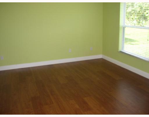 4286 Southwest Whitebread Road Port St. Lucie, FL 34953 - Photo 4 of 6 a view of an empty room with wooden floor and a window