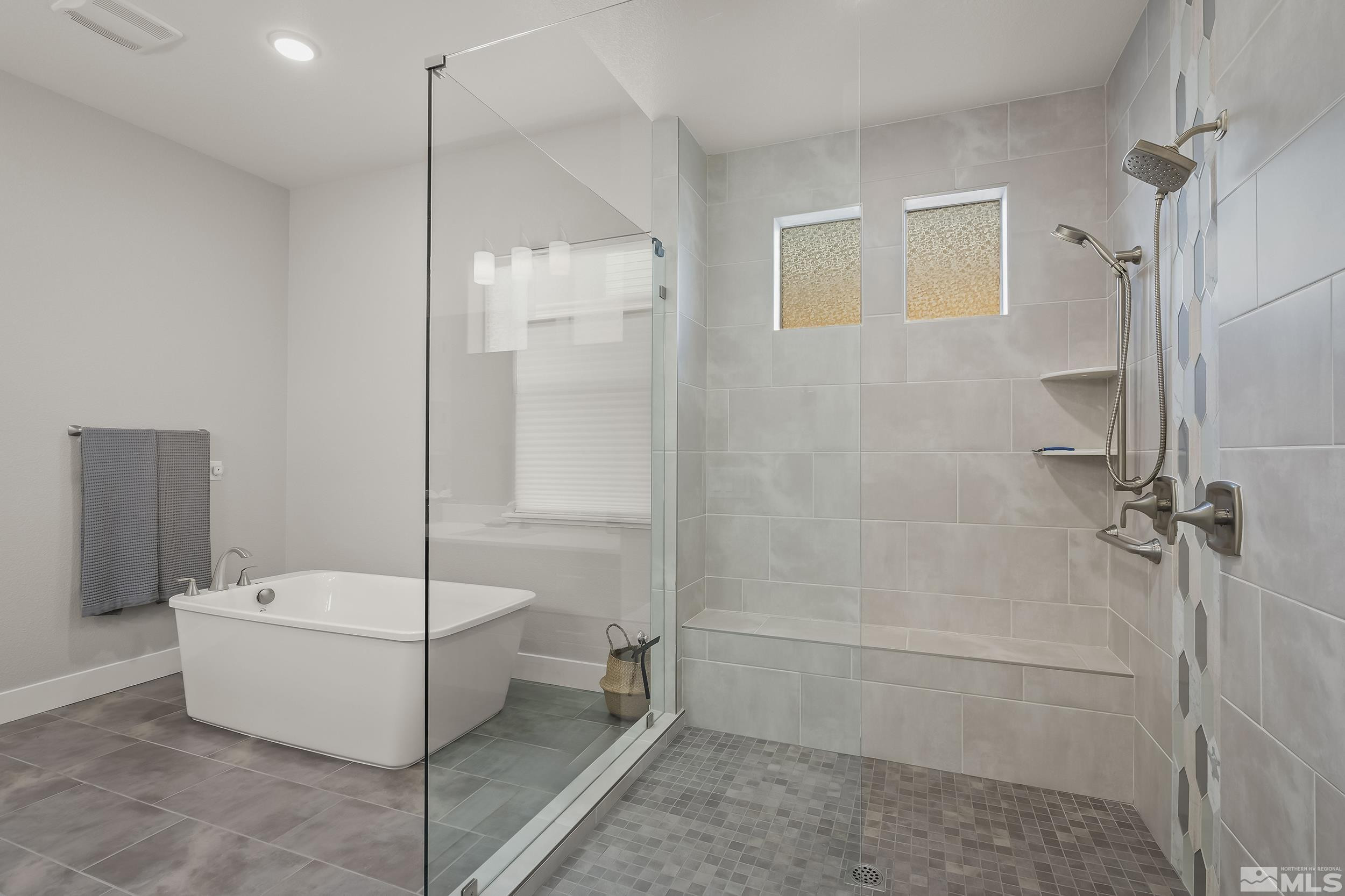 8780 Larkhaven Trail Reno, NV 89523 - Photo 15 of 28 a bathroom with a tub and shower