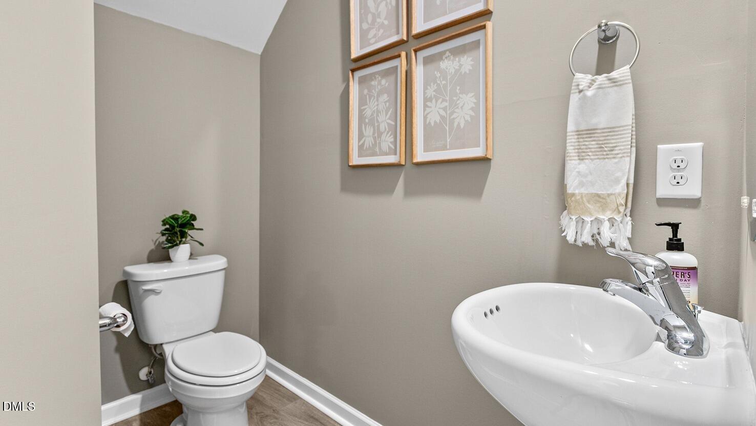 186 Canopy Drive Graham, NC 27253 - Photo 11 of 23 a bathroom with a sink a toilet and a mirror