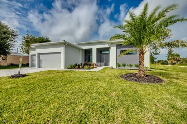 a front view of a house with a yard