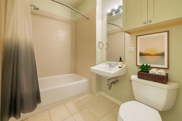 a bathroom with a toilet a sink and bathtub