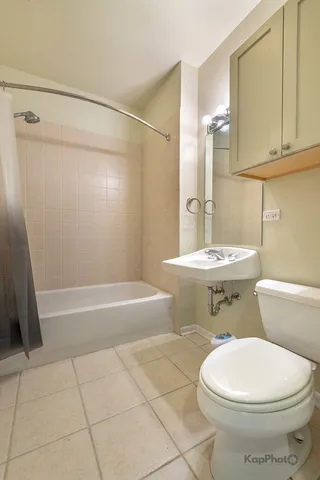 a bathroom with a shower and a bath tub