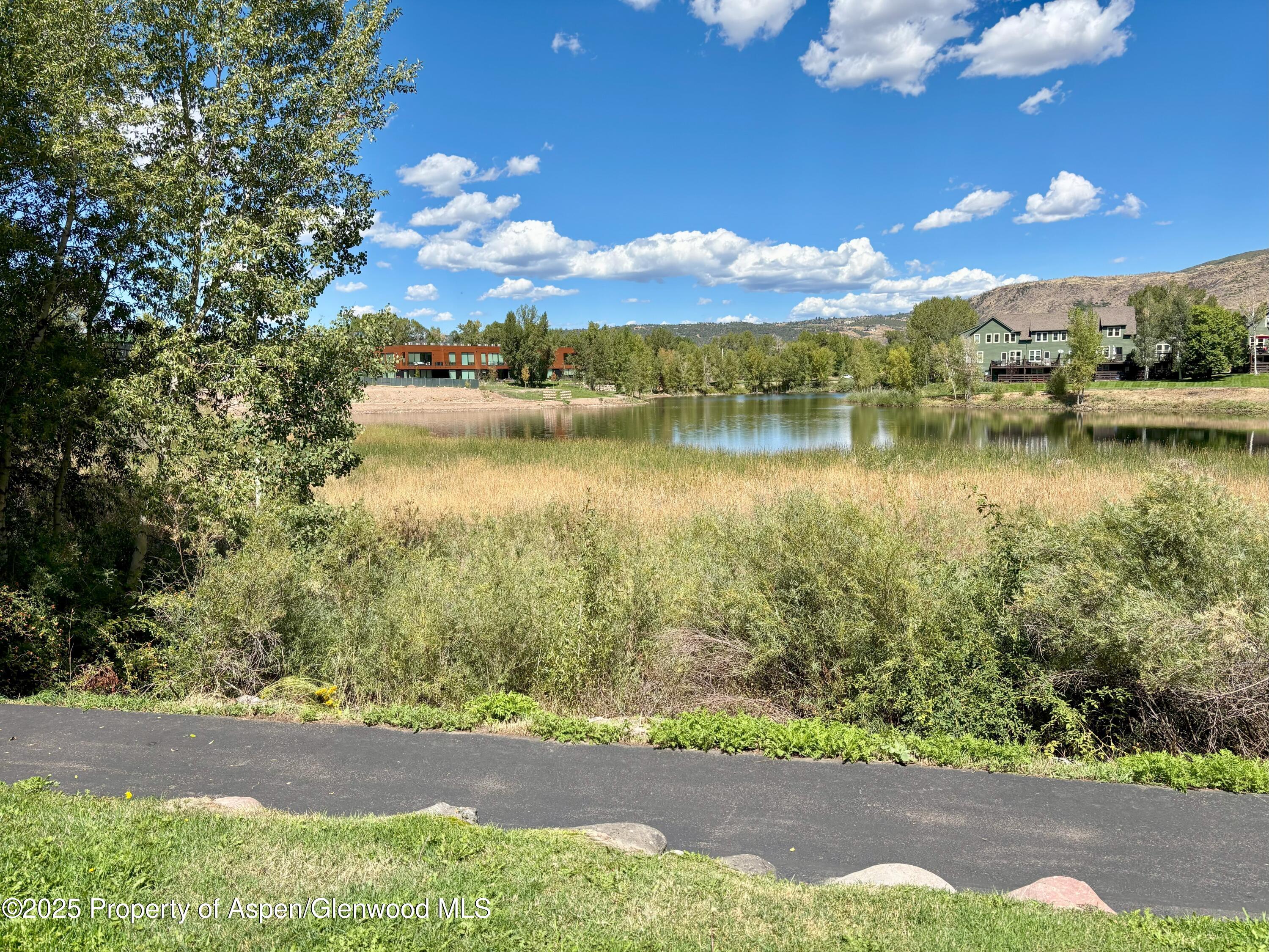 712 Lakeside Drive Basalt, CO 81621 - Photo 15 of 21 a view of a lake with a yard