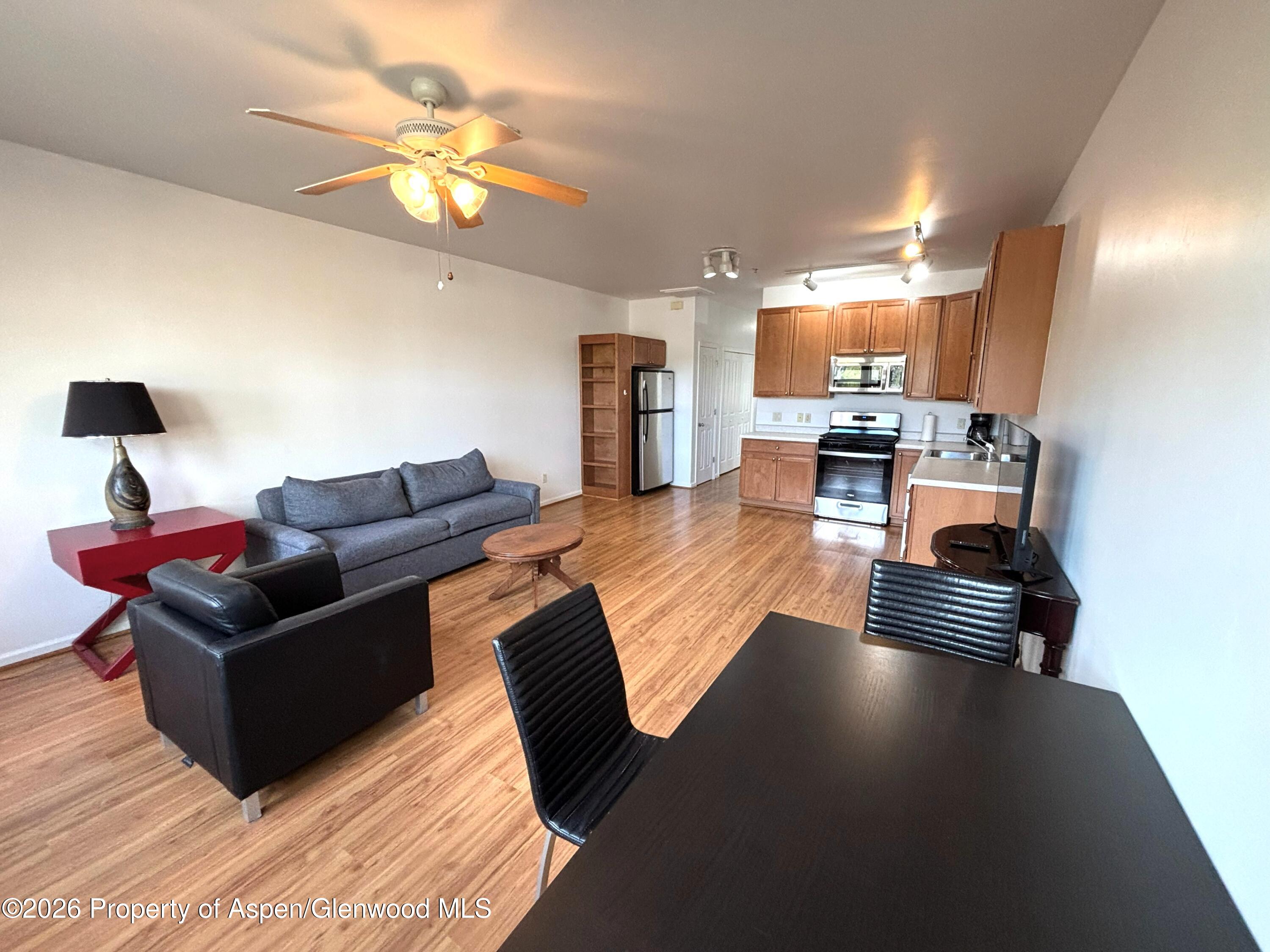 712 Lakeside Drive Basalt, CO 81621 - Photo 2 of 21 a living room with furniture and a chandelier