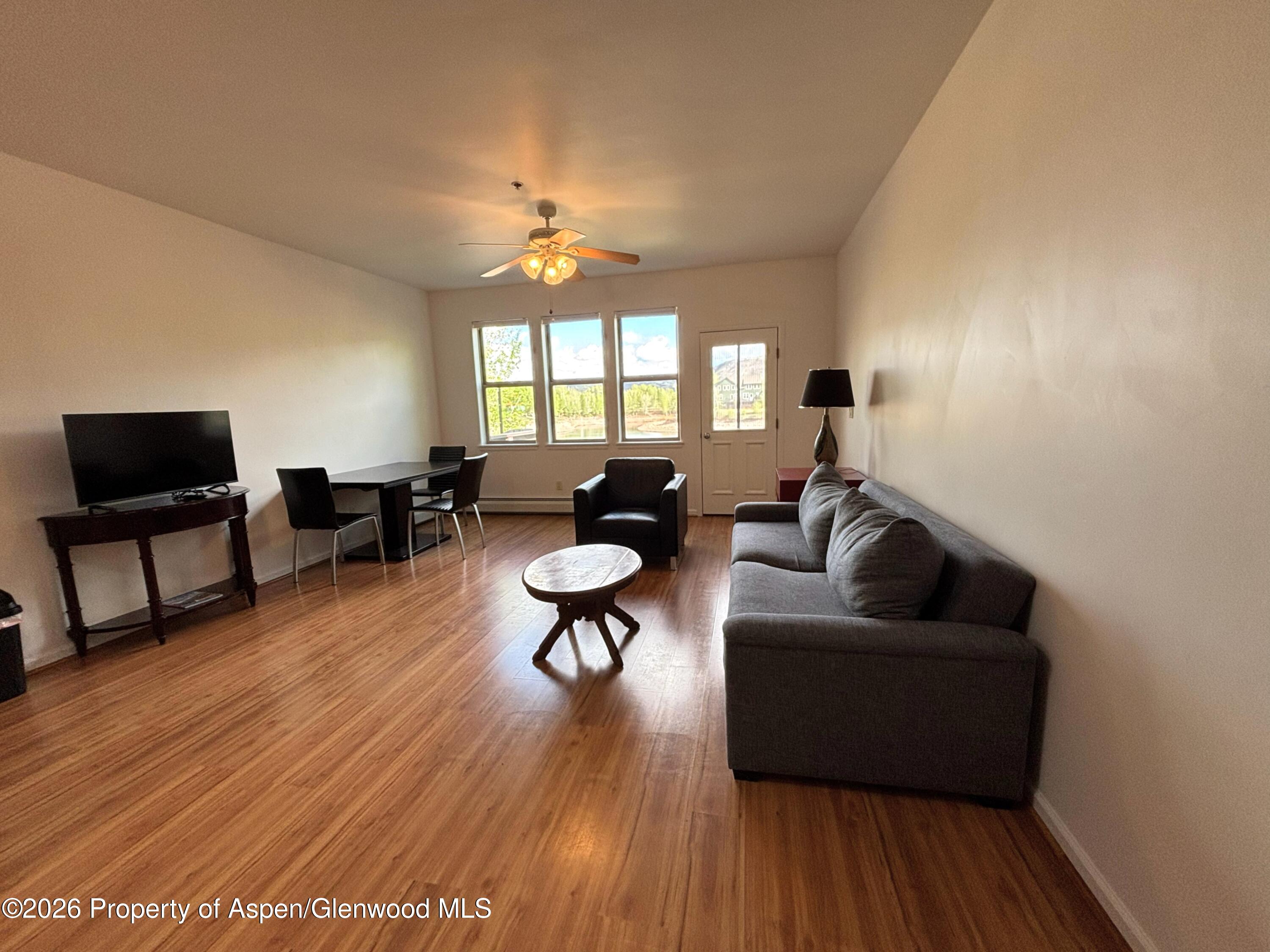 712 Lakeside Drive Basalt, CO 81621 - Photo 6 of 21 a living room with furniture and a flat screen tv