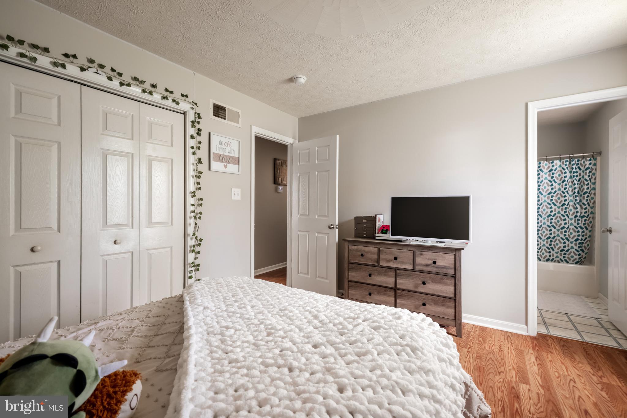 143 Club House Road Front Royal, VA 22630 - Photo 17 of 38 a bedroom with a bed and a flat screen tv